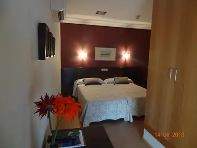 Cama o camas de una habitación en Hostal El Lechuguero