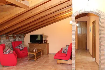 Una televisión o centro de entretenimiento en Apartamentos Clavería