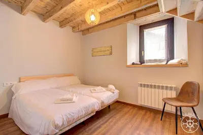 Cama o camas de una habitación en CASA ERA CUMA de Alma de Nieve