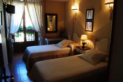 Cama o camas de una habitación en Hotel Casa Frauca