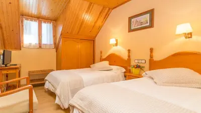 Cama o camas de una habitación en Hostal Casa Rosita