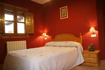Cama o camas de una habitación en Apartamentos Cañones de Guara y Formiga