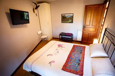 Cama o camas de una habitación en Apartamentos Turísticos Mallos de Huesca
