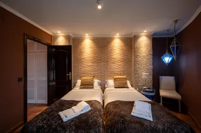 Cama o camas de una habitación en Apartamentos Los Angeles