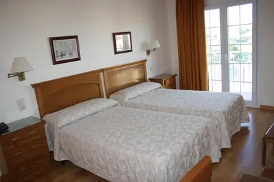 Cama o camas de una habitación en Hotel Mar de Aragón