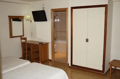 Cama o camas de una habitación en Hotel Mar de Aragón