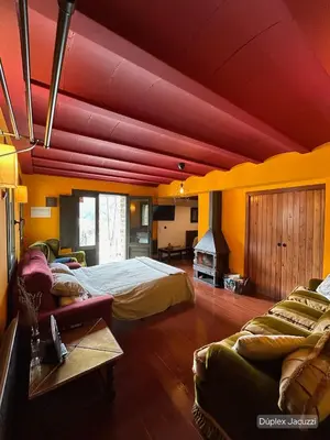 Cama o camas de una habitación en Apartamentos dúplex en Casa Rural Fundanal en Hoz de Jaca