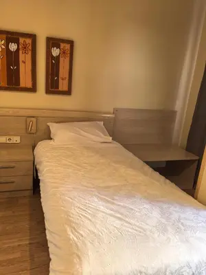 Cama o camas de una habitación en Hostal San Isidro