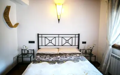 Cama o camas de una habitación en Ca la Teresa
