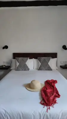 Cama o camas de una habitación en Hostal Blavet