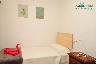 Cama o camas de una habitación en Apartamentos Dos Torres Gandalf - Excelente ubicación centrica con garaje incluido