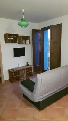 Una televisión o centro de entretenimiento en Apartamentos Plan Dulcis