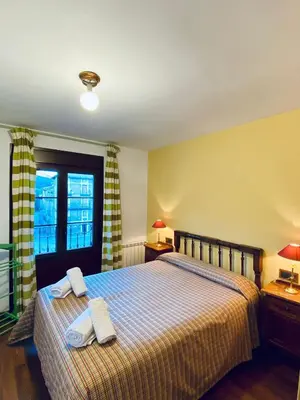 Cama o camas de una habitación en Apartamentos Turismo Rural Casa Alfós