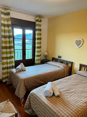 Cama o camas de una habitación en Apartamentos Turismo Rural Casa Alfós