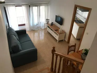 Una televisión o centro de entretenimiento en Apartamento dúplex en el centro de Huesca