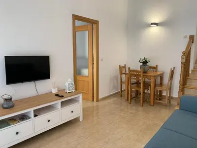 Una televisión o centro de entretenimiento en Apartamento dúplex en el centro de Huesca