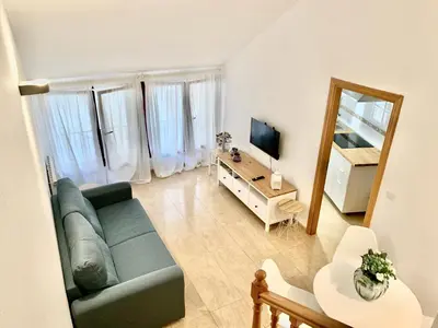 Una televisión o centro de entretenimiento en Apartamento dúplex en el centro de Huesca