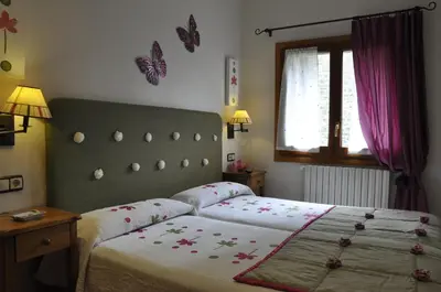 Cama o camas de una habitación en Apartamentos Los Pirineos - Atencion personal