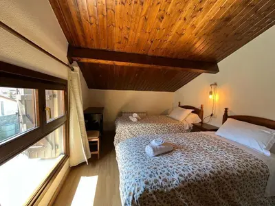 Cama o camas de una habitación en Duplex La Valle Ordesa-Ainsa