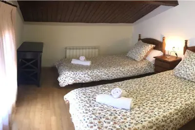 Cama o camas de una habitación en Duplex La Valle Ordesa-Ainsa