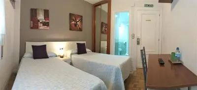 Cama o camas de una habitación en Hostal Meson Del Barro - Alojamientos Pamplona