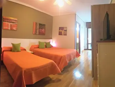 Cama o camas de una habitación en Hostal Meson Del Barro - Alojamientos Pamplona