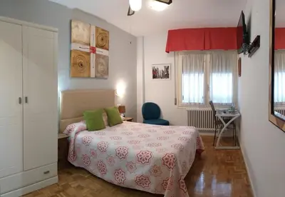 Cama o camas de una habitación en Hostal Meson Del Barro - Alojamientos Pamplona