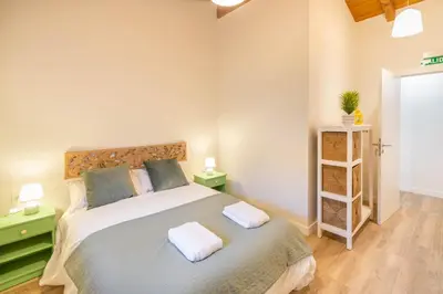 Cama o camas de una habitación en Espectacular apartamento a 10 minutos de Pamplona