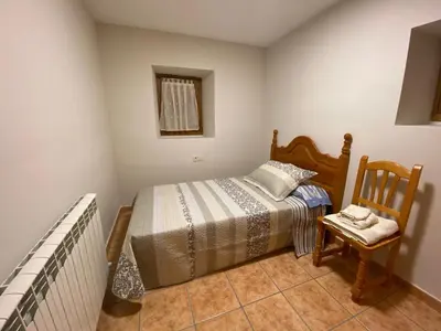 Cama o camas de una habitación en CASA PEDRO BERGUA