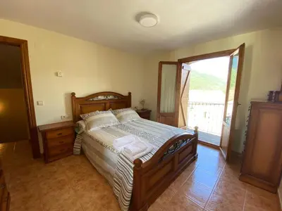 Cama o camas de una habitación en CASA PEDRO BERGUA