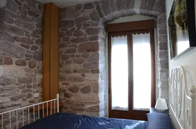 Cama o camas de una habitación en Apartamentos Elizondo