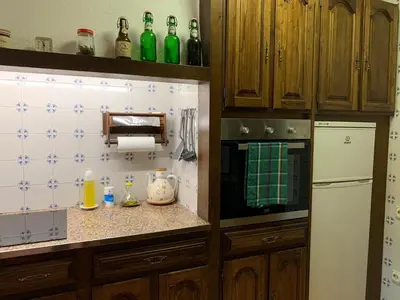 Una cocina o zona de cocina en EVA & TRAVEL - Triplex La Cavallada