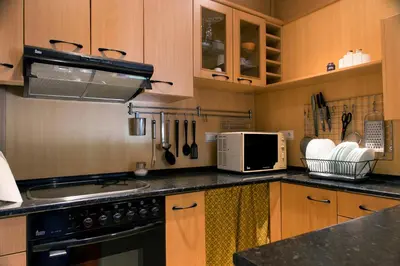Una cocina o zona de cocina en Ático con terraza en Graus-Pirineo de Huesca