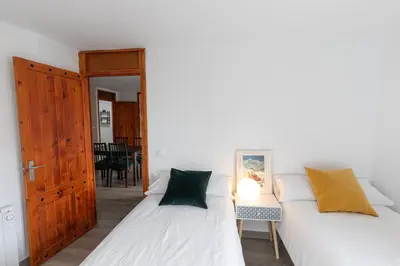 Cama o camas de una habitación en Anayet - Plaza del Reloj en FORMIGAL - by PIRINEOS 360