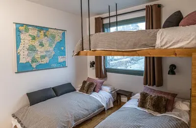 Cama o camas de una habitación en Los Huertos de Sallent - tucasaenlospirineos