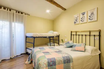 Cama o camas de una habitación en Casa rural MAZA especial grupos