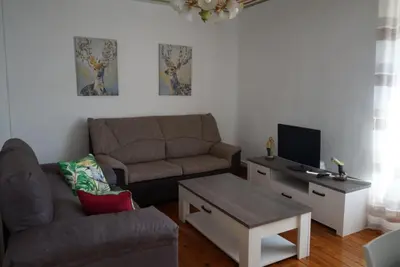 Una televisión o centro de entretenimiento en Apartamento «El Balcón de la Calle Mayor»