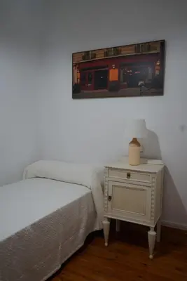 Cama o camas de una habitación en Apartamento «El Balcón de la Calle Mayor»