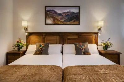Cama o camas de una habitación en Hostal Bosque de Gamueta