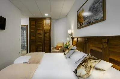 Cama o camas de una habitación en Hostal Bosque de Gamueta