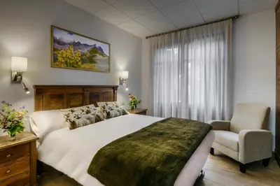 Cama o camas de una habitación en Hostal Bosque de Gamueta