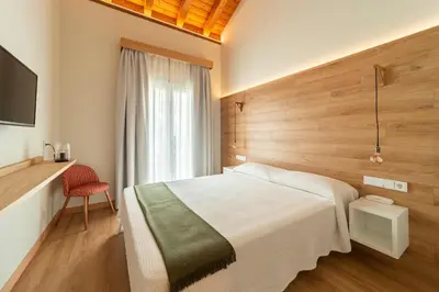 Cama o camas de una habitación en HOTEL RESTAURANTE CASA LUISA