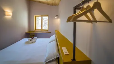 Cama o camas de una habitación en Eco-Apartaments Cal Rossa de Taús