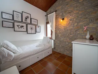 Cama o camas de una habitación en eva y maría CASA RURAL