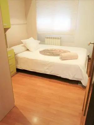 Cama o camas de una habitación en APARTAMENTO HUESCA