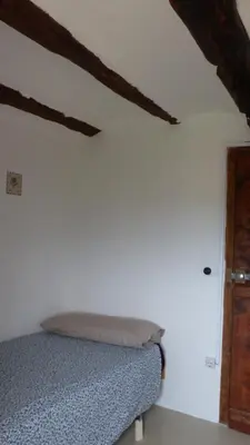 Cama o camas de una habitación en Casa Sisco, dins de la Vall d'Àger