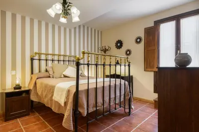 Cama o camas de una habitación en Amplio apartamento de montaña con terraza y WiFi