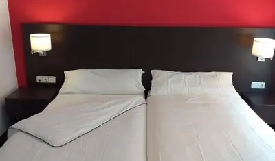 Cama o camas de una habitación en Hostal Meson de Paco
