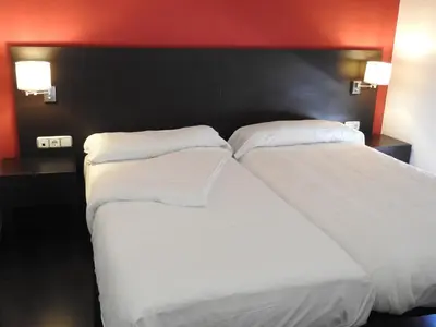 Cama o camas de una habitación en Hostal Meson de Paco