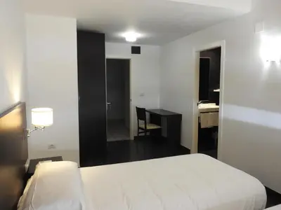 Cama o camas de una habitación en Hostal Meson de Paco